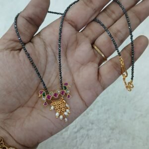 Peacock jadau with black diamonds