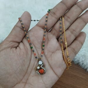 Coral Peacock pendant with kattutheega blackdiamonds