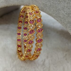 2.8 Designer gold copy ruby and uncut Micropolish bangles (set of 2)