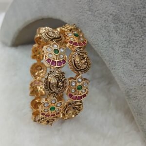 Latest peacock nakshi with ruby stones bangles
